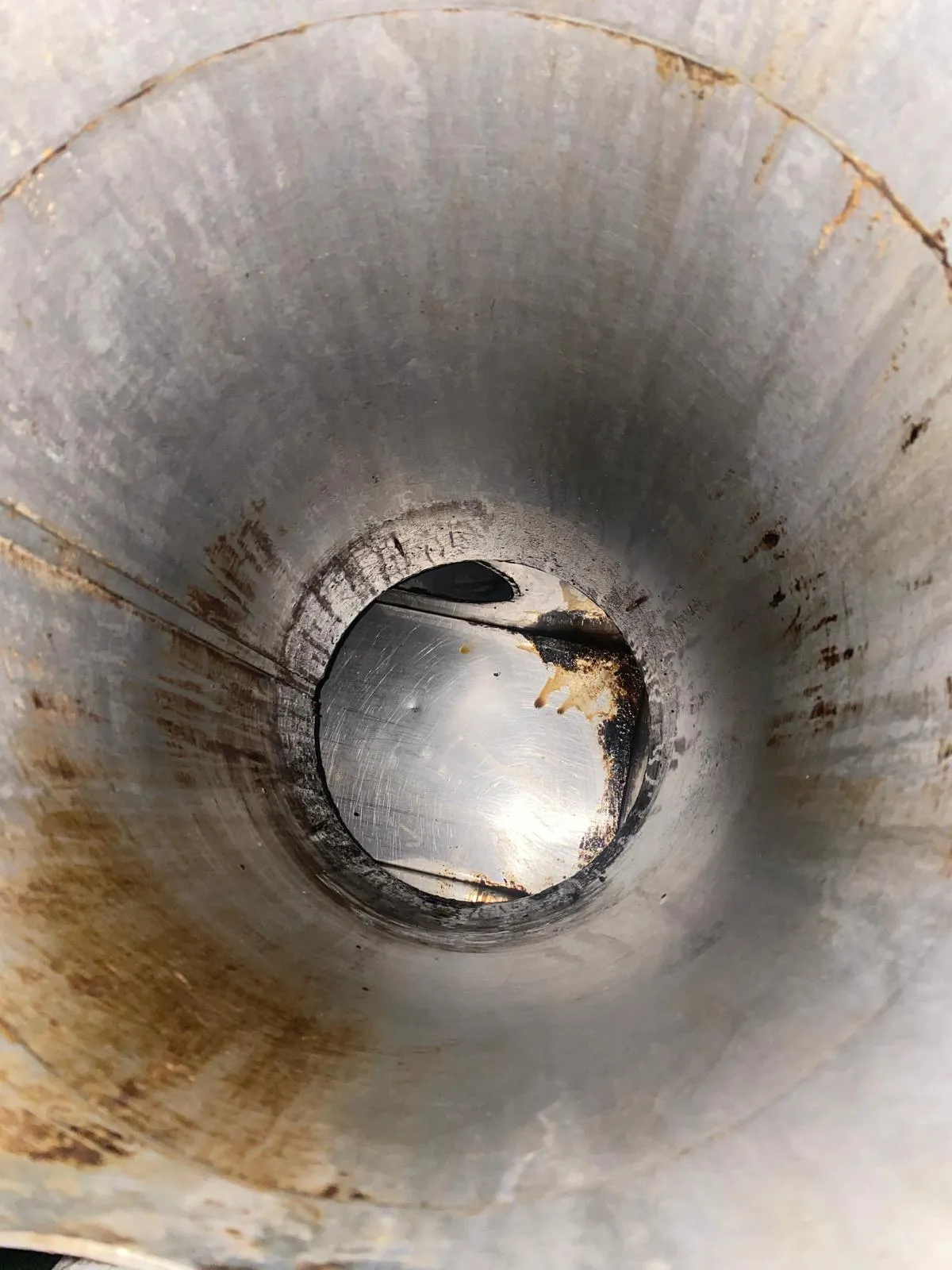 Same extract duct interior cleaned back to bare metal