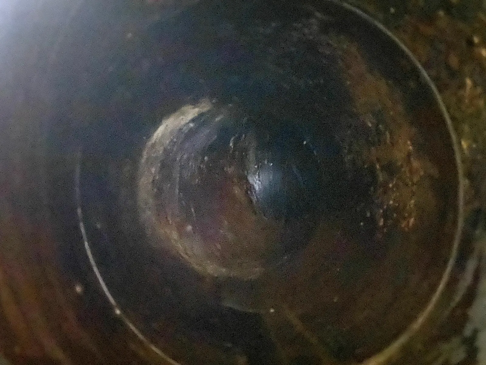 Extract duct interior before cleaning, coated in grease